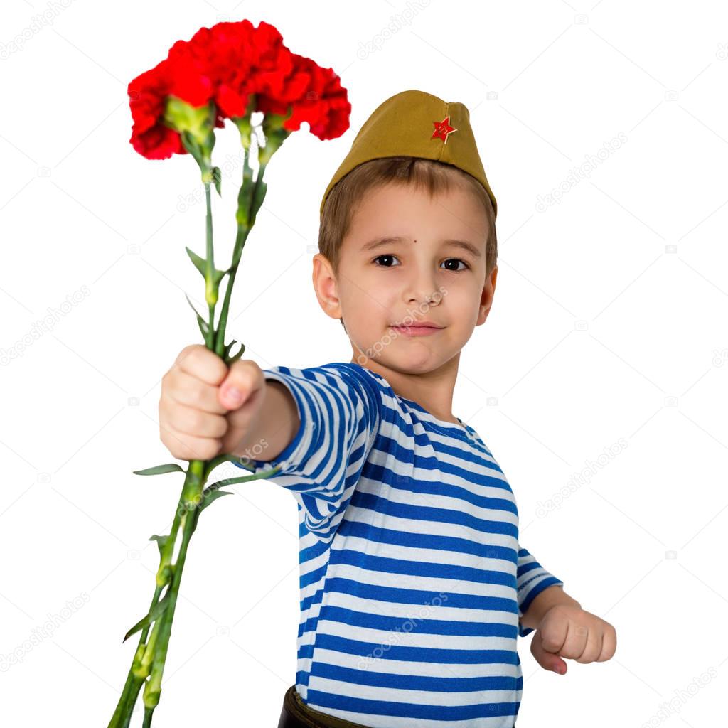 Portrait of a child in military uniform with flowers in hands. May 9 is Victory Day.