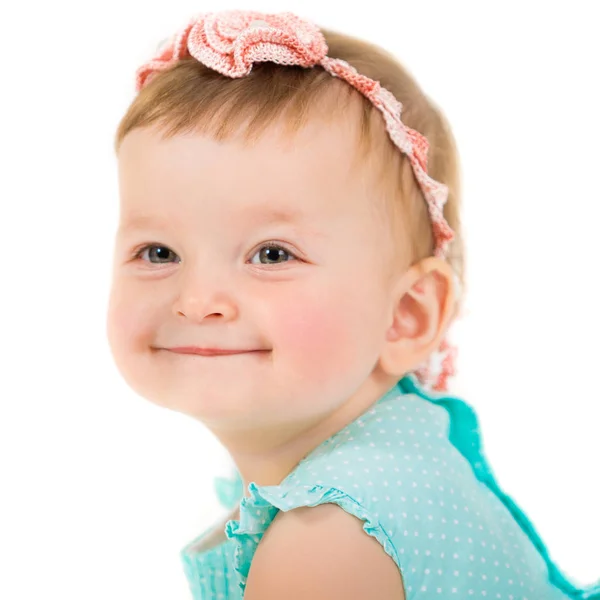 Portrait of a beautiful smiling girl. Child on a white background. Photo closeup Stock Image