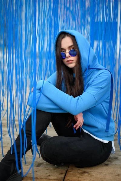 Young Beautiful Woman Fashionably Posing Blue Sunglasses Blue Background Ribbons — Stock Photo, Image