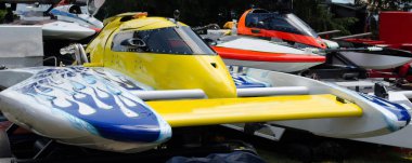 Close-up of a group of colorful hydroplane racing boats