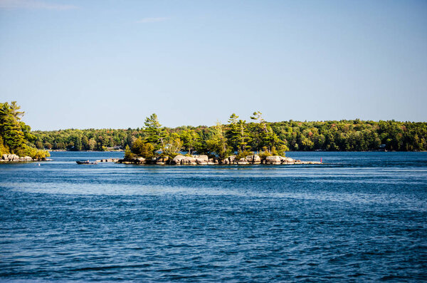 View of islands with small fishing boat on the St. Lawrence River