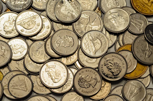 Overhead Closeup of Canadian silver Coins and Loonies spread out