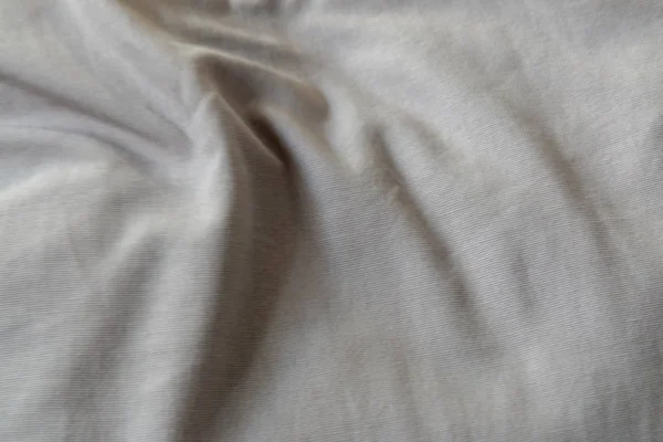 Льняной текстильный фон со складками; размытый фон — стоковое фото
