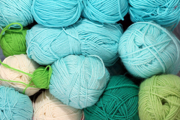 multi-coloured bright balls of thread for knitting or crocheting