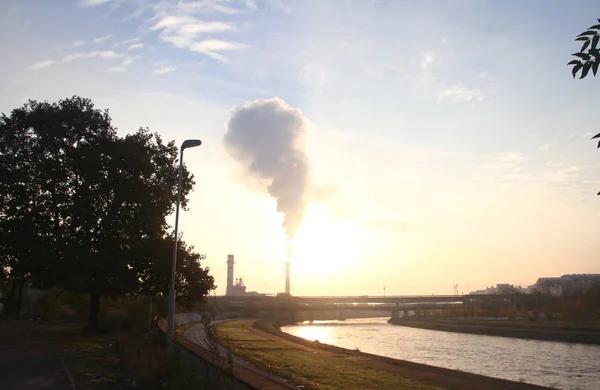 Factory smoke in sunrise — Stock Photo, Image