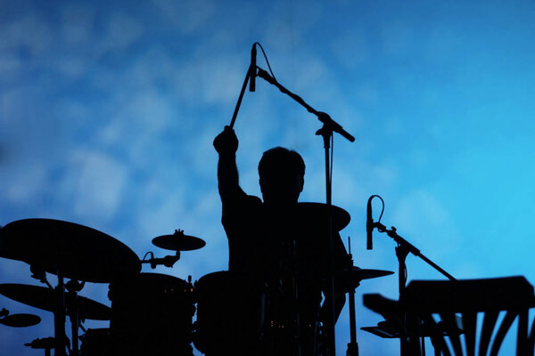 Drum player silhouette on the stage
