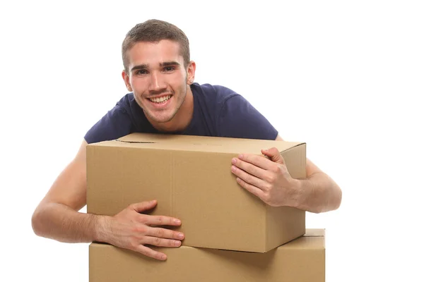 Lachende jongeman met grote dozen. op een witte achtergrond. — Stockfoto