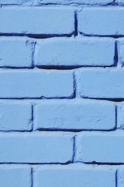 Bakstenen muur geschilderd blauwe verf close-up. Achtergrond. — Stockfoto