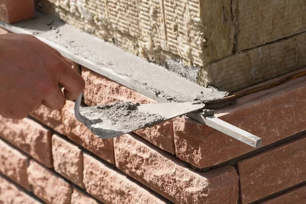 Brick laying on top of a mineral insulation — Stock Photo, Image