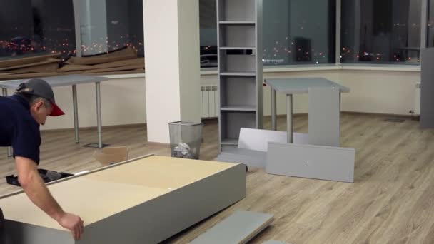 Craftsman Finished The Assembly Of The Cabinet For Papers In The