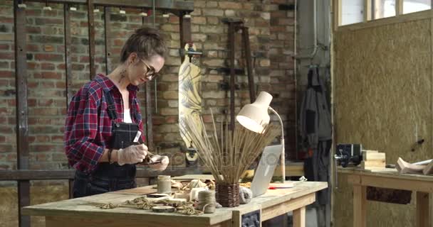 Young Pretty Hipster Paints Her Rustic Wooden Toys Hipster Girl — стоковое видео