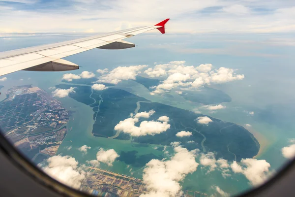 Clouds and sky as seen through window of an aircraft — Stock Photo, Image