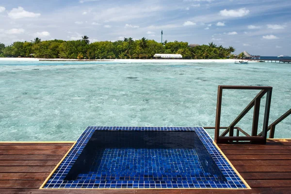 Private pool at balcony facing crystal clear water on water vill — Stock Photo, Image