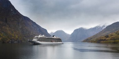 Cruise liner in fjord - travel and nature background clipart