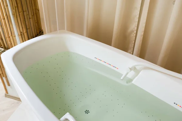 Empty jacuzzi, tub filled with water in the spa — Stock Photo, Image