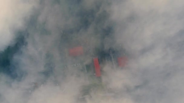 Landing in haze. Flying in fog. Fly in mist. Aerial camera shot. Flight above the clouds towards. Misty weather, view from above. — Stock Video