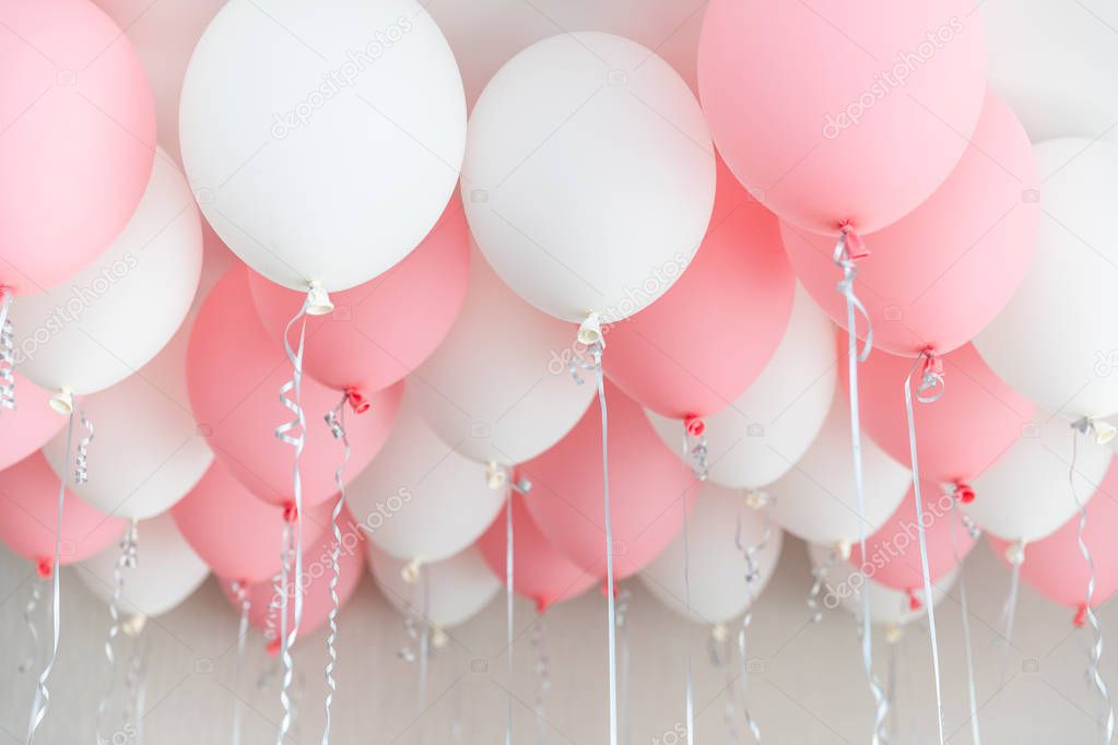 Colourful balloons, pink, white, streamers. Helium Ballon floating in birthday party. Concept balloon of love and valentine