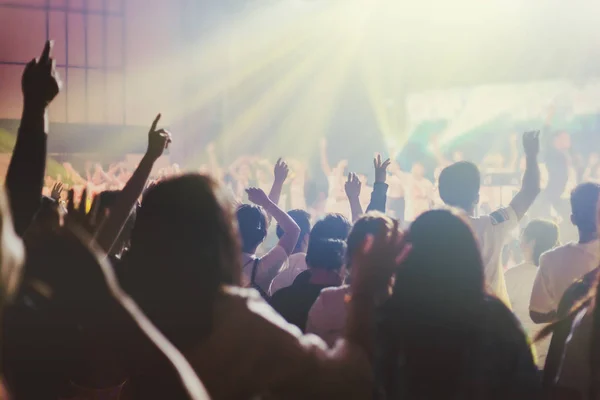 Soft focus of Christian worship with raised hand,music concert