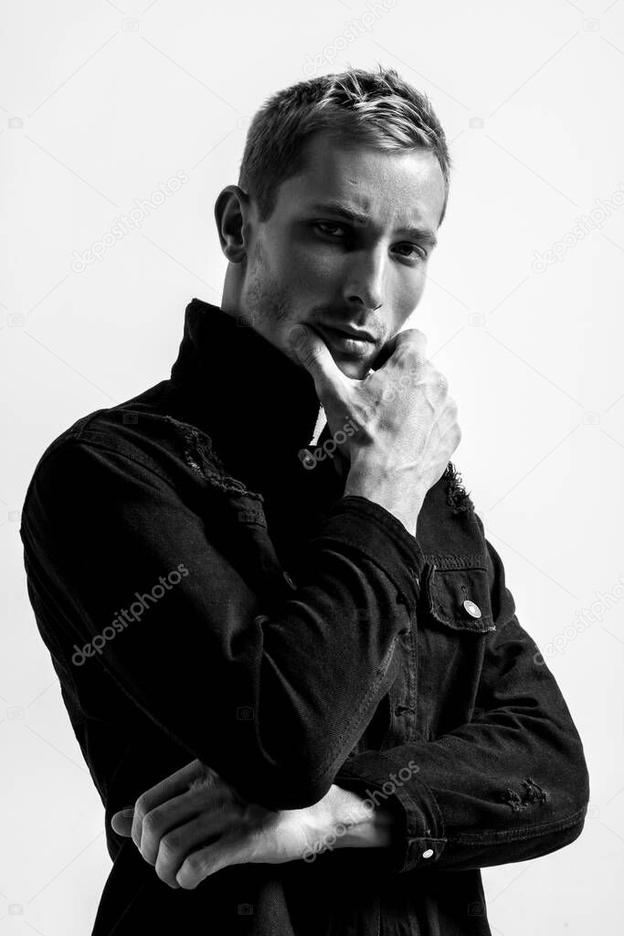 Portrait Of A Handsome Fashion Man In Black Jean Jacket On White Background