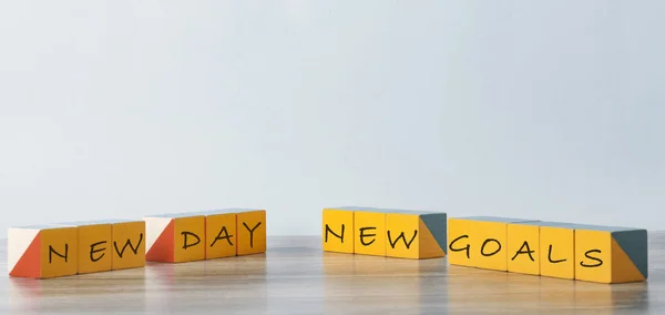 Success motivation concept. On the yellow cubes lying on the log table inscription: 