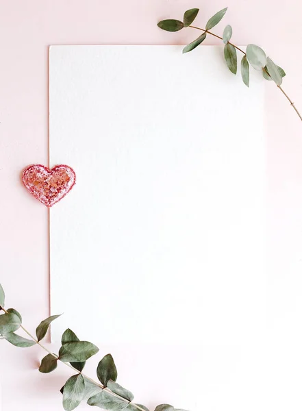 Background with copy space blank on pink background with pink glittered hearts, eucalyptus branch. White paper top view, flat lay, minimal style. Moke up card. — 스톡 사진