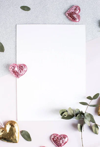 Background with copy space blank on white table with glitter heart, eucalyptus branch, flowers and leafs. White paper top view, flat lay, minimal style. Moke up card. — 스톡 사진