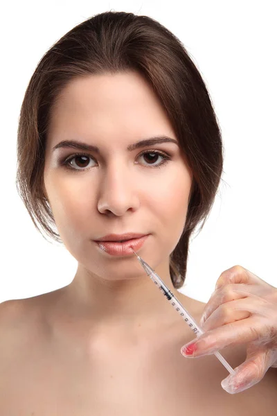 Aantrekkelijke jonge vrouw krijgt cosmetische injectie, geïsoleerd op witte achtergrond. — Stockfoto