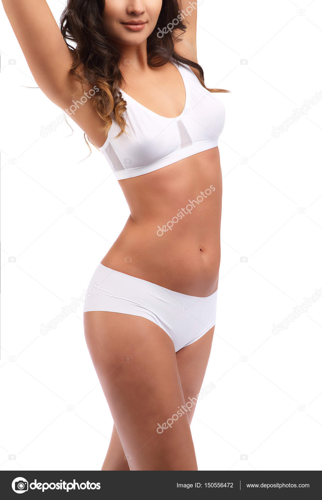 Woman standing in white cotton panties and bra isolated on white, hands up,  unrecognizable body Stock Photo by ©fenixlive 150556472