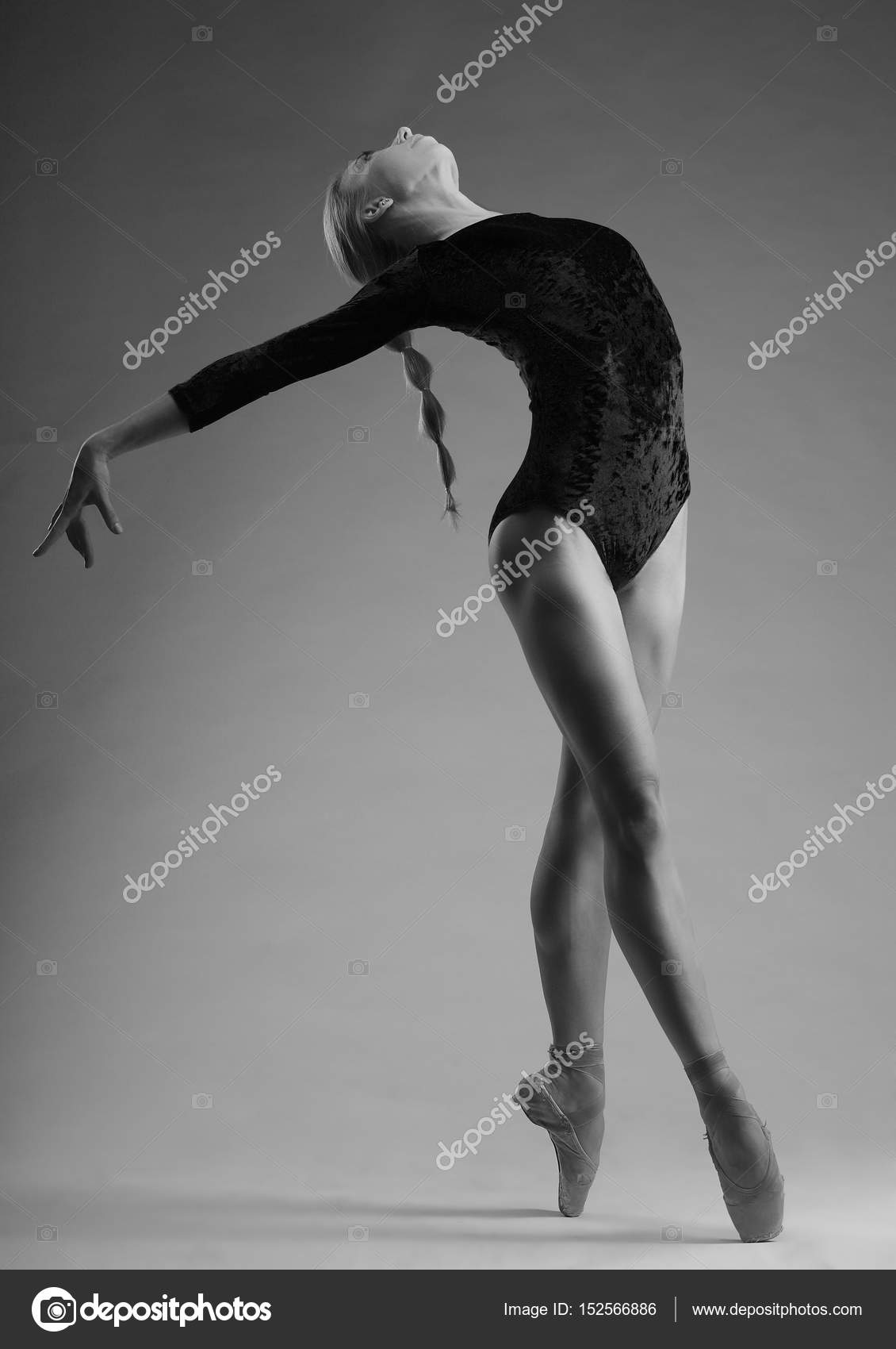 Young and incredibly beautiful ballerina posing dancing in studio