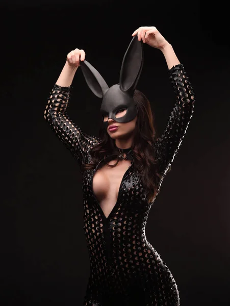 Portrait of sexy young woman posing in rabbit mask and bodysuit — Stock Photo, Image