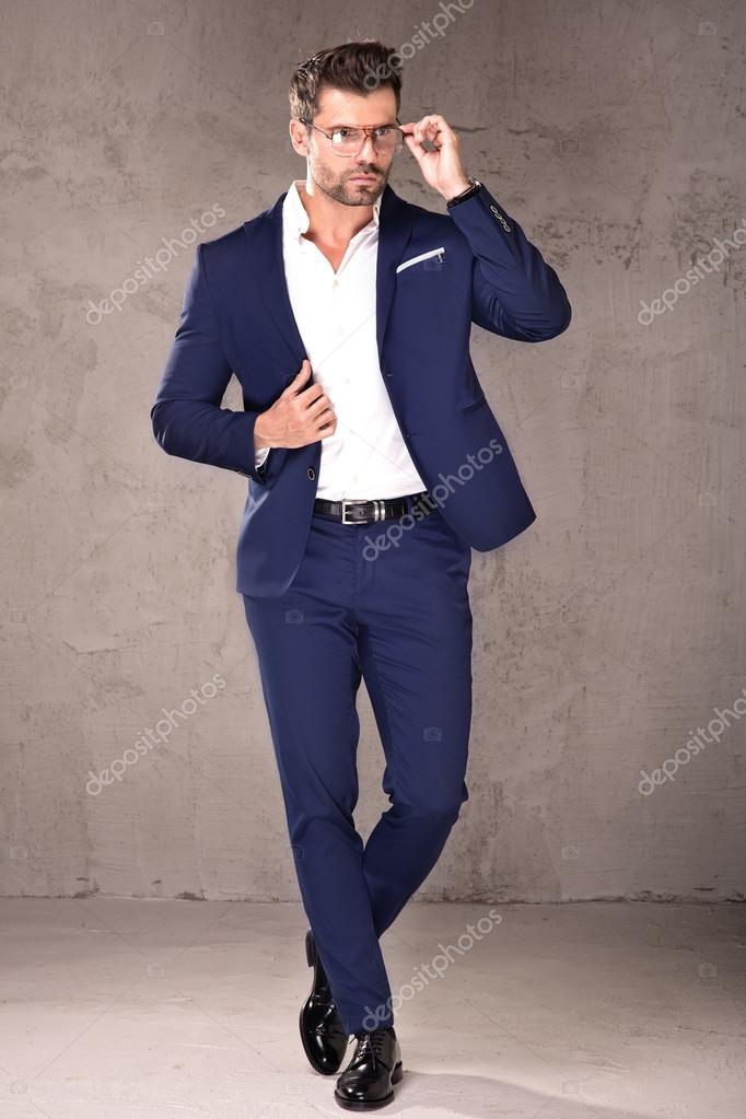 Elegant handsome man in suit stock photo by neonshot 127429168