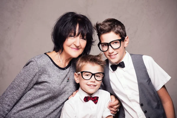 Grandmother with grandchilds posing. — Stock Photo, Image