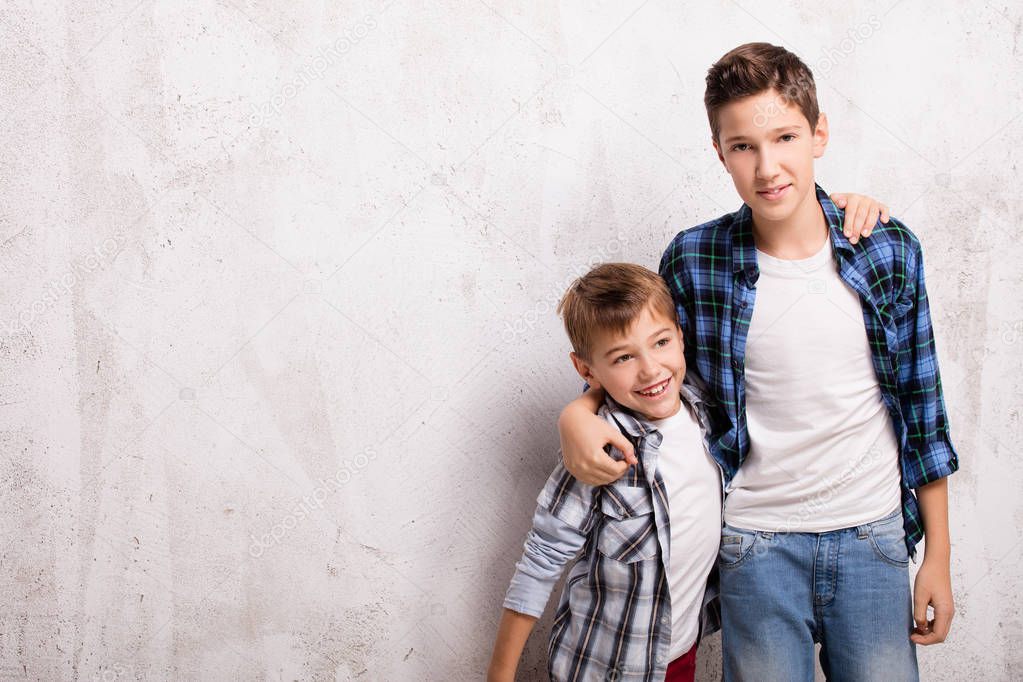 Sister Leaning On Brothers Shoulder Posing In Studio Portrait High-Res  Stock Photo - Getty Images