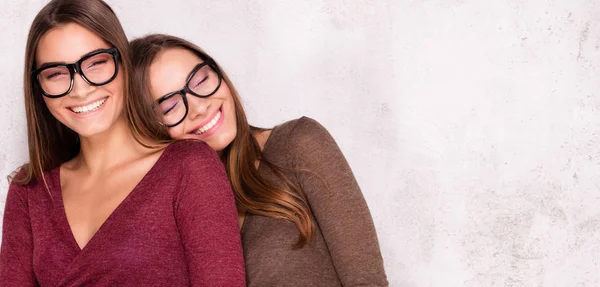 Smiling beautiful twins, autumn style. — Stock Photo, Image