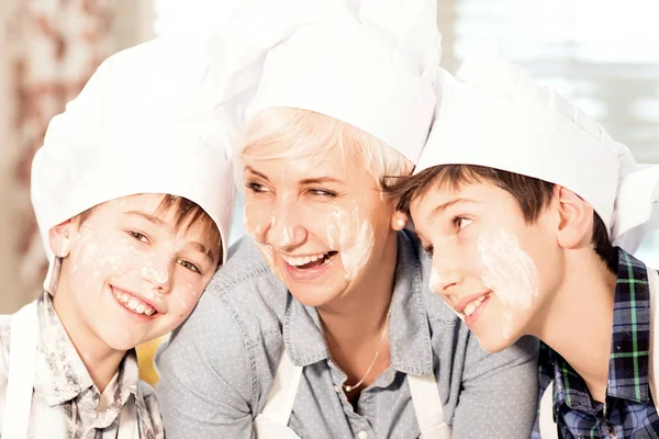 Mother with kids baking. — Stock Photo, Image