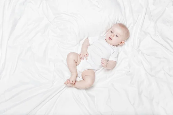 Happy little baby lying. — Stock Photo, Image