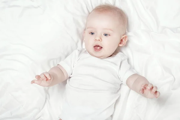 Happy little baby lying. — Stock Photo, Image