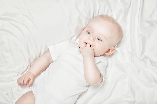 Happy little baby lying. — Stock Photo, Image