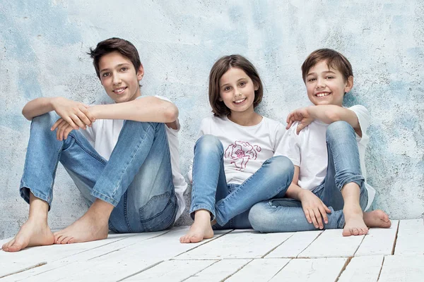 Happy children in jeans. — Stock Photo, Image