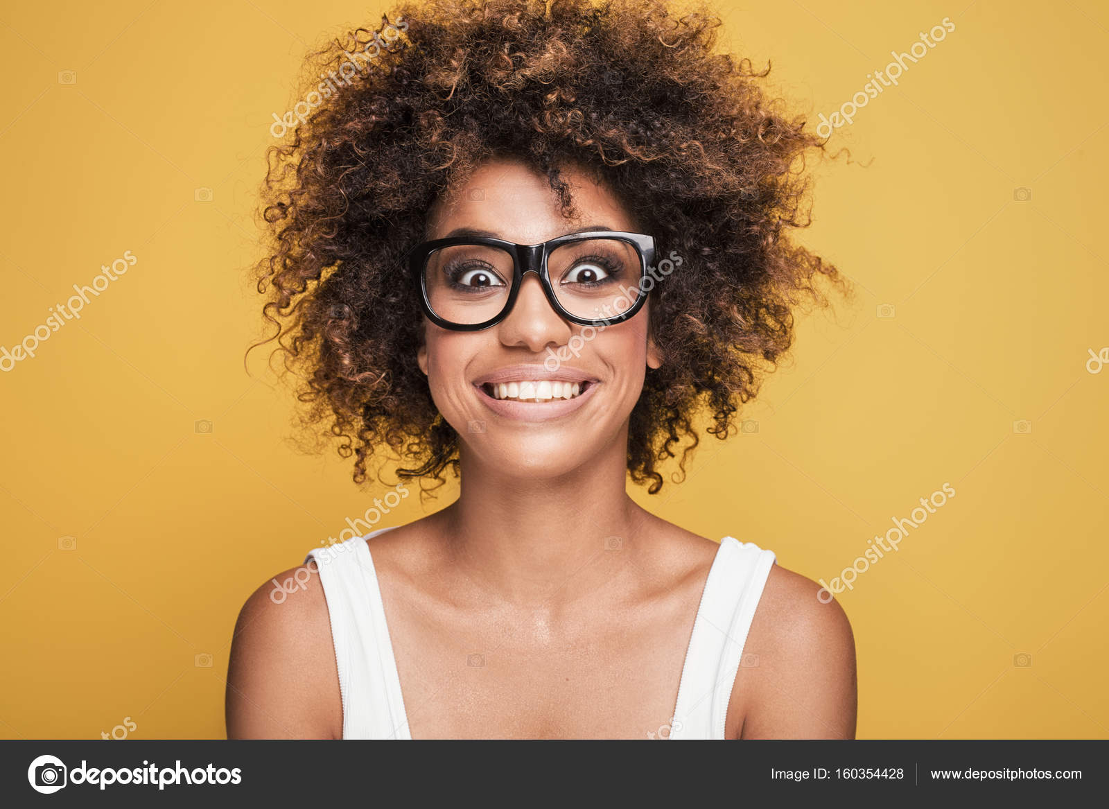 African american girl wearing eyeglasses,smiling. Stock Photo by ©NeonShot  160354428