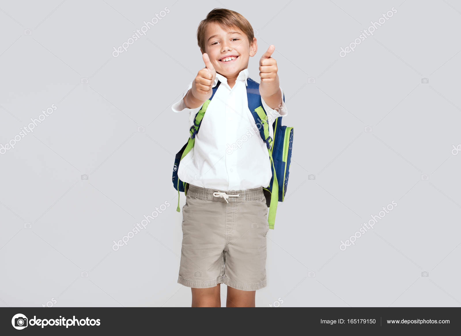 Smiling little boy with backpack. Stock Photo by ©NeonShot 165179150