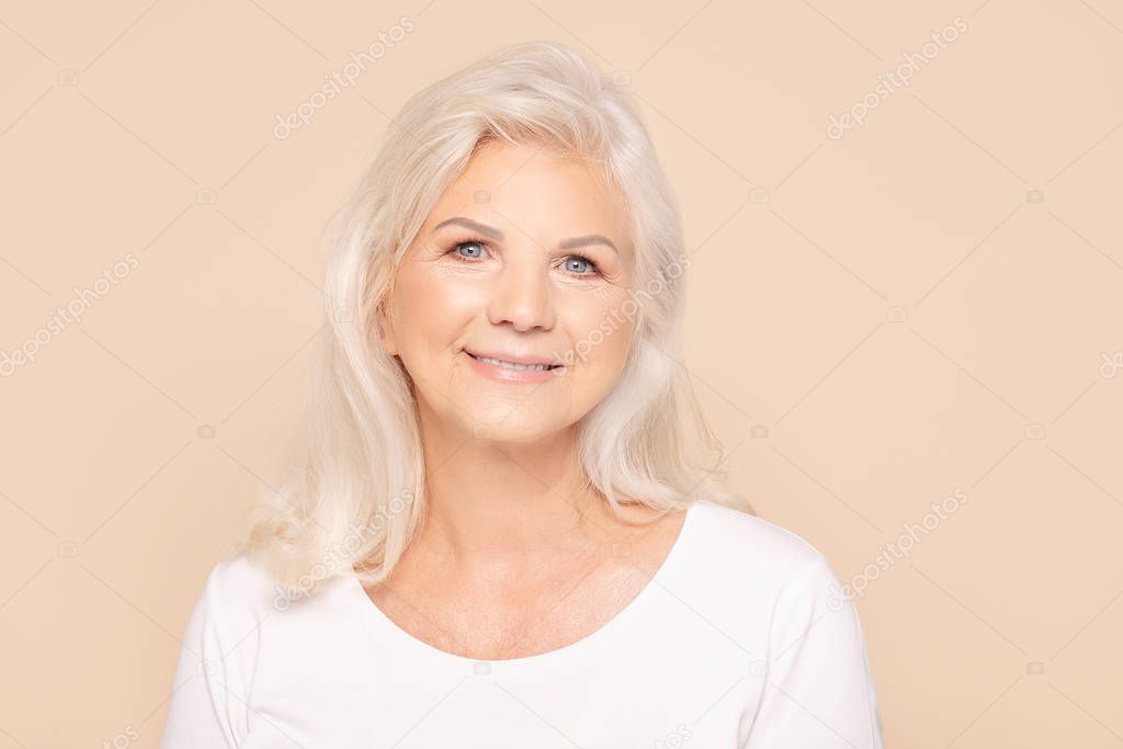 Smiling senior lady looking at camera.