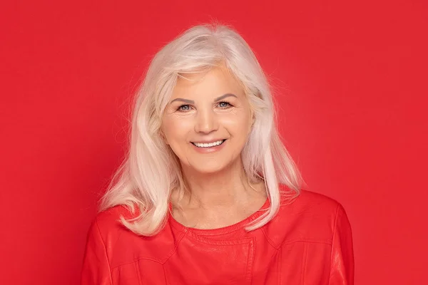 Senior lady in red fashionable clotes. — Stock Photo, Image