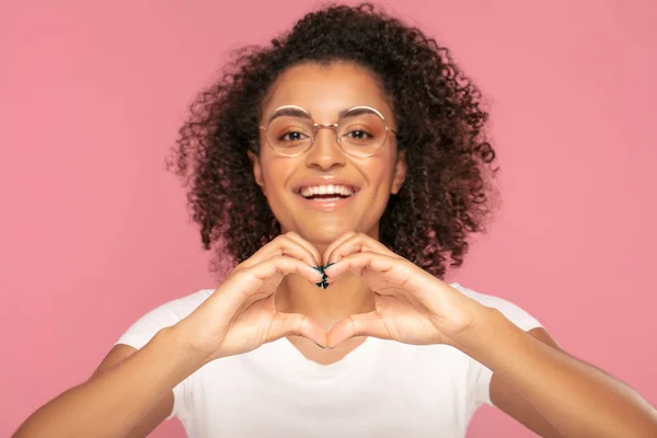 Afro girl doing heart symbol shape. — Stock Photo, Image