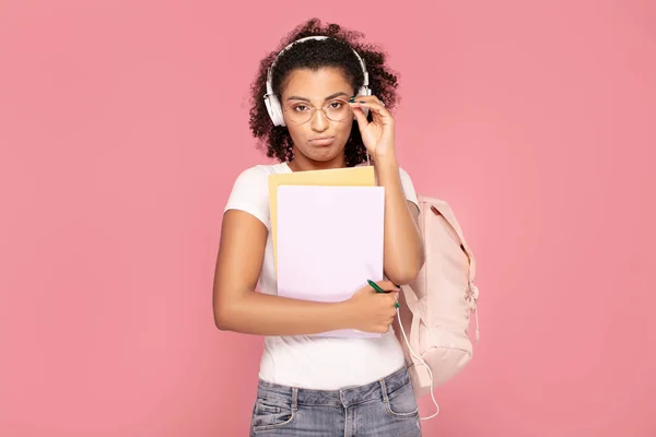 Sad student girl with backpack and notebooks. — Stock Photo, Image