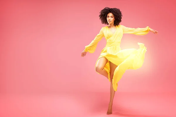 Afro Young Woman Dancing Yellow Maxi Dress Pink Pastel Studio — Stock Photo, Image
