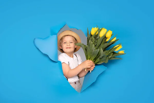 Young Little Caucasian Kid Holding Yellow Bouquet Flowers Blue Background — Stock Photo, Image