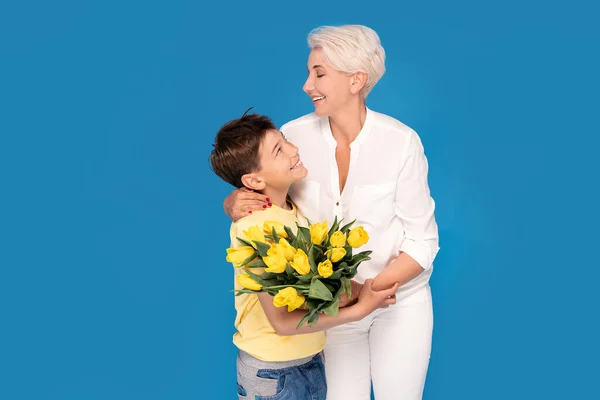 Boy Holding Bouquet Yellow Tulip Flowers Son Gives His Mother — Stock Photo, Image