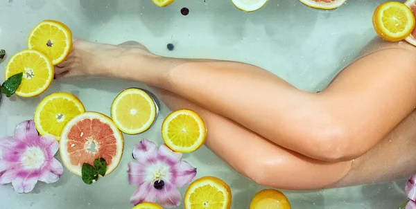 Woman Relaxing Bath Orange Flowers Closeup Female Legs — Stock Photo, Image