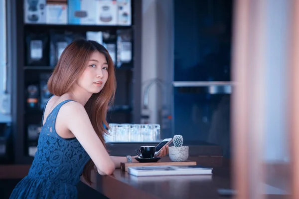 portrait of asia happy woman resting in cafe on holiday